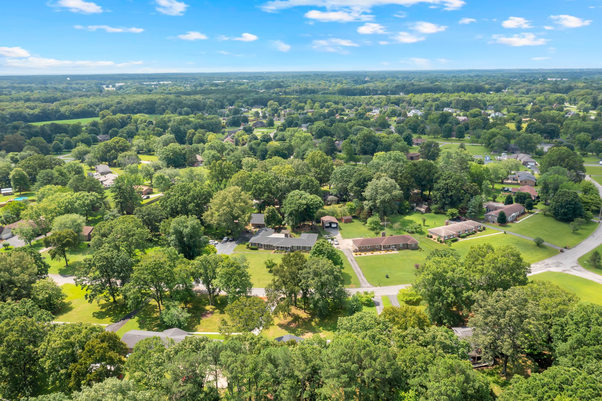 305 12 Oaks Road Tullahoma, TN 37388 - Photo 43 of 56 an aerial view of residential houses with outdoor space and trees