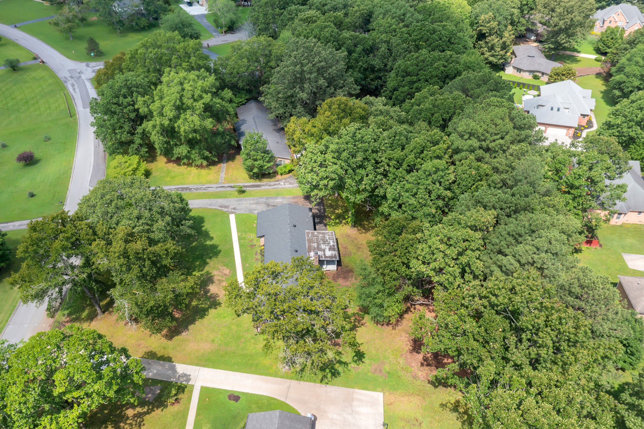 305 12 Oaks Road Tullahoma, TN 37388 - Photo 44 of 56 an aerial view of a house with a yard