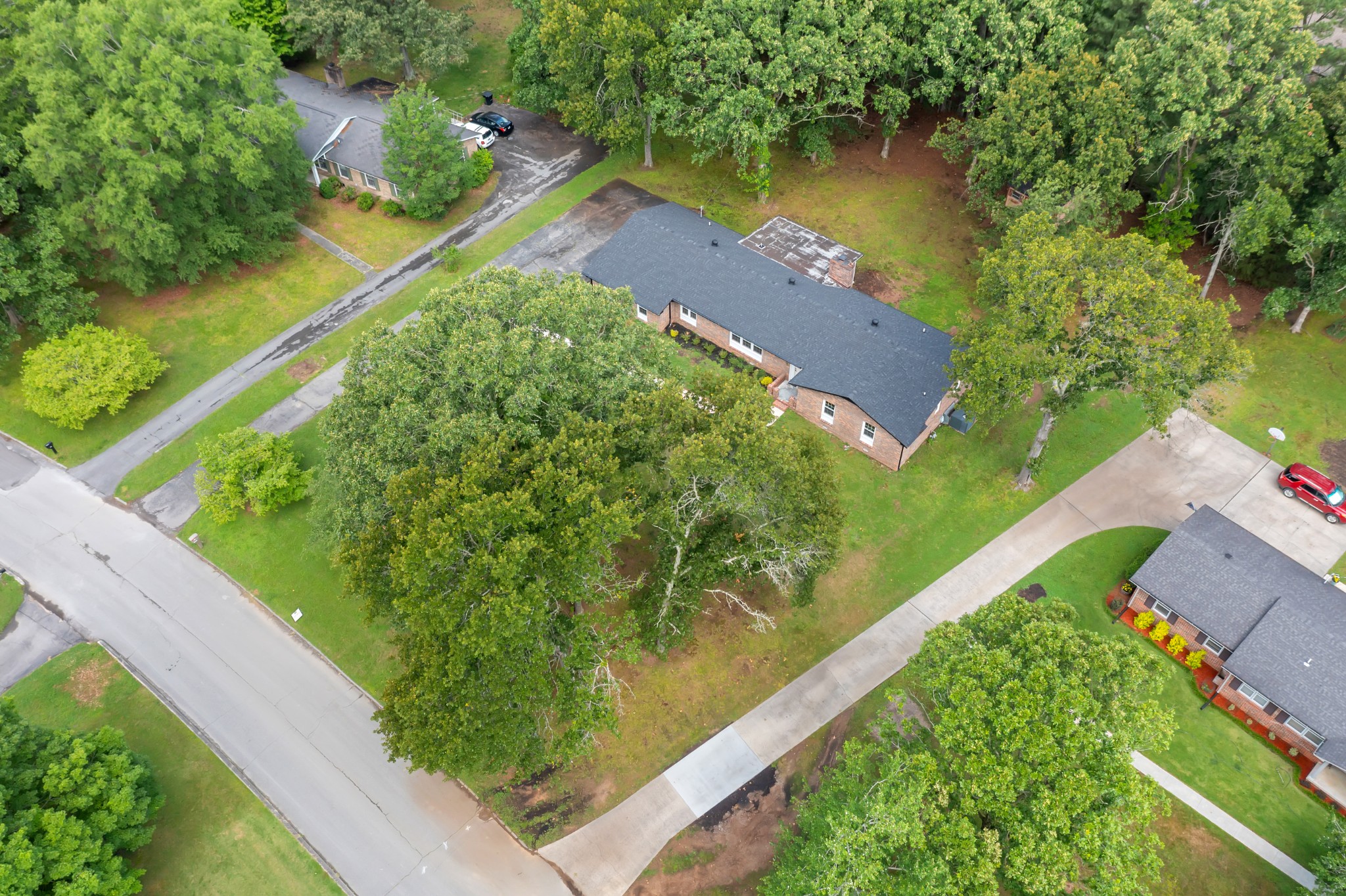 305 12 Oaks Road Tullahoma, TN 37388 - Photo 45 of 56 a view of a lake with a yard and large trees