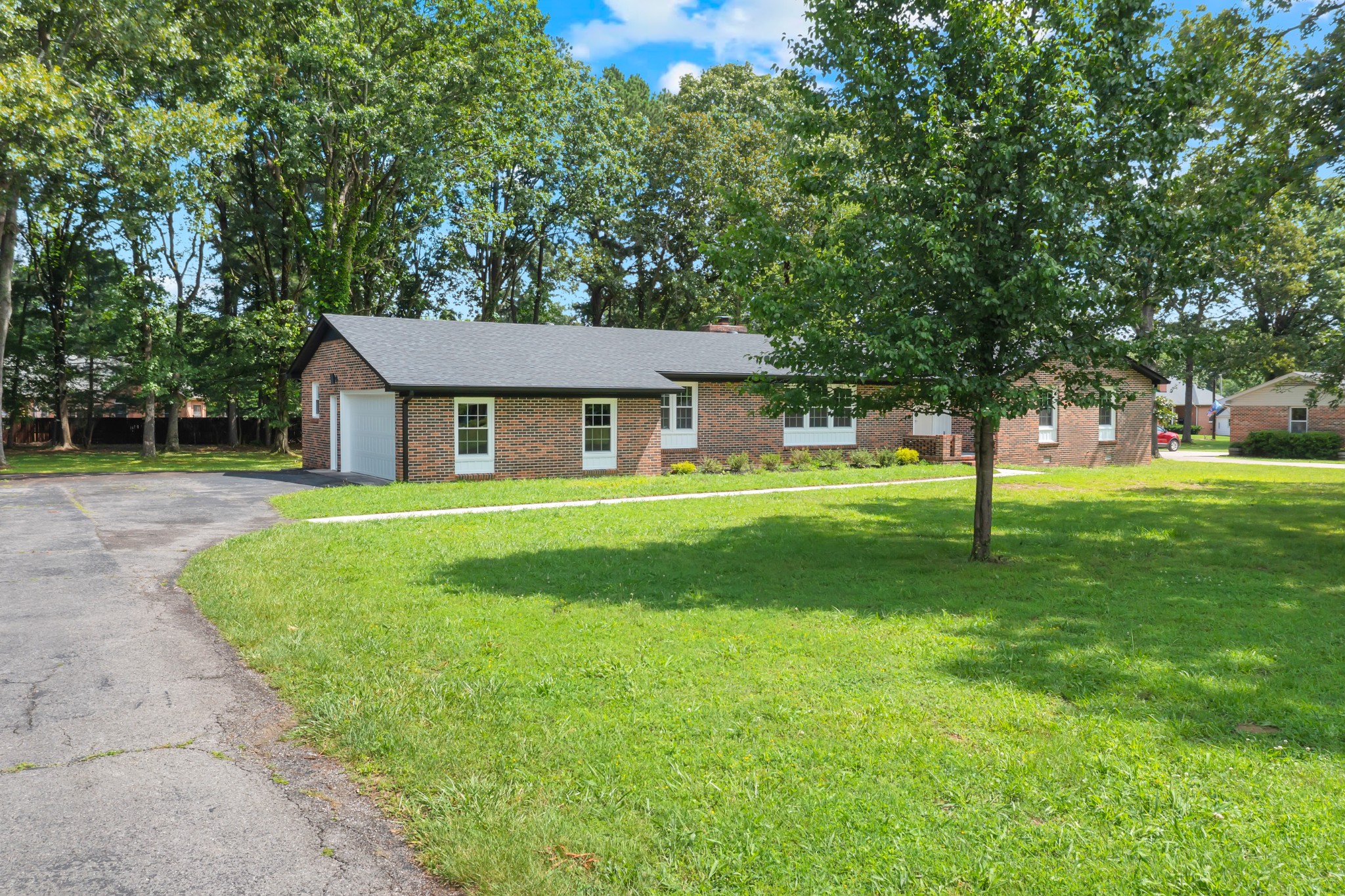 305 12 Oaks Road Tullahoma, TN 37388 - Photo 52 of 56 a front view of a house with a yard