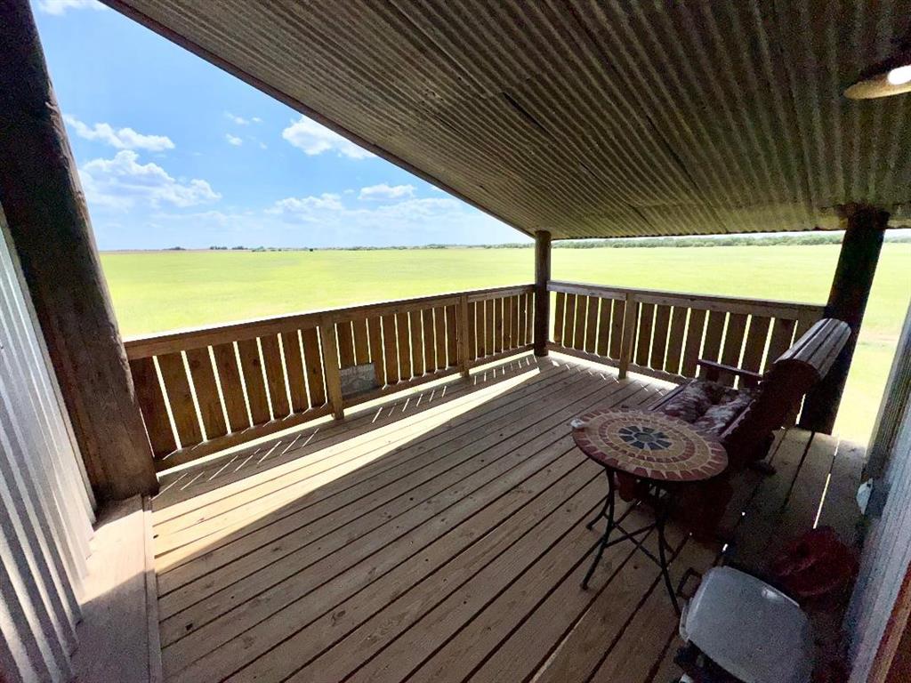 323 Slaughter Road Olney, TX 76374 - Photo 12 of 18 a view of balcony with wooden floor