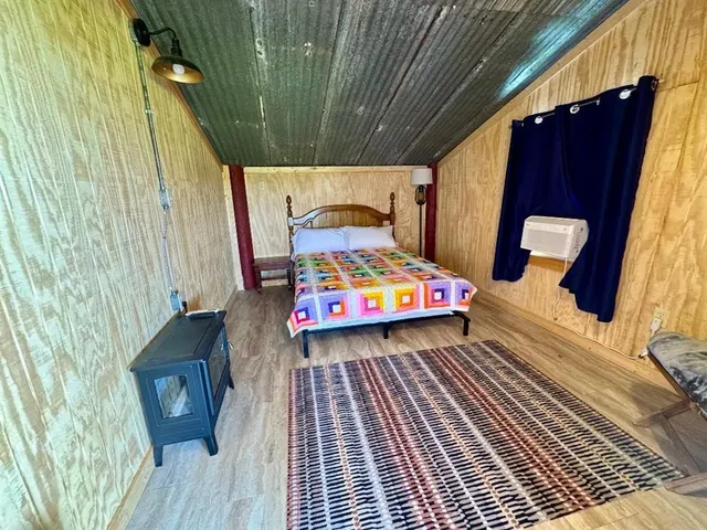 a balcony view with two chairs and a potted plant