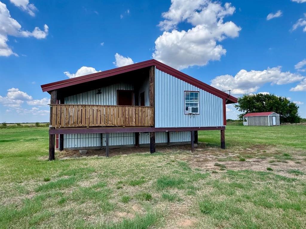 323 Slaughter Road Olney, TX 76374 - Photo 2 of 18 a house view with a garden space