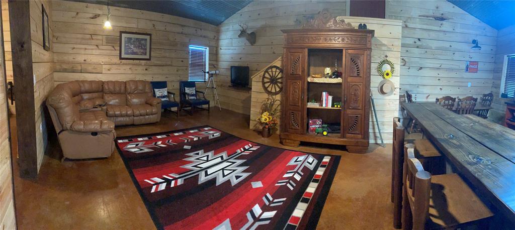 323 Slaughter Road Olney, TX 76374 - Photo 3 of 18 a living room with furniture and a fireplace
