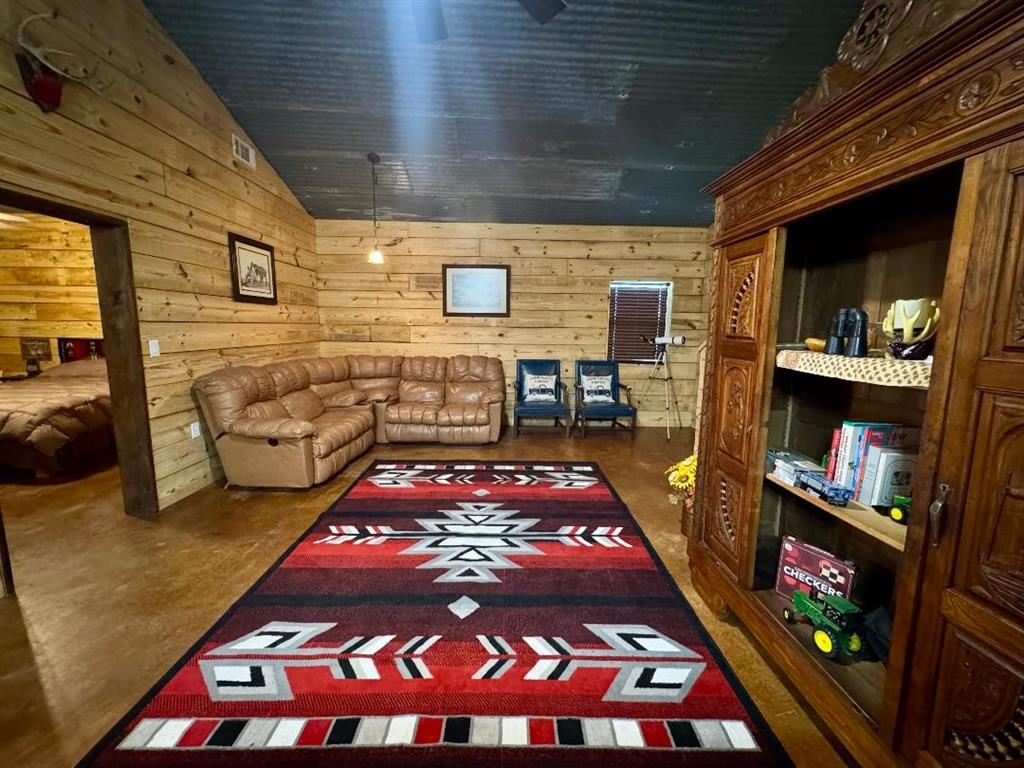 323 Slaughter Road Olney, TX 76374 - Photo 5 of 18 a bed room with furniture and a rug