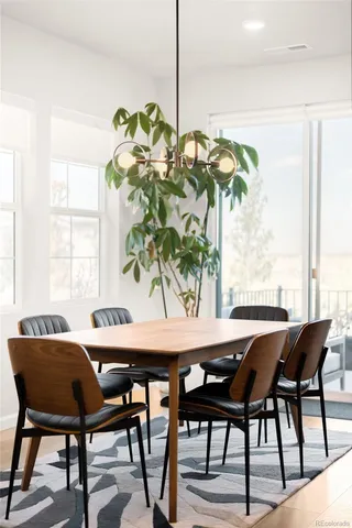 a dining room table with chairs and window