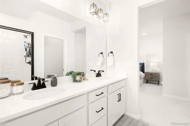 a bathroom with a double vanity sink and a mirror