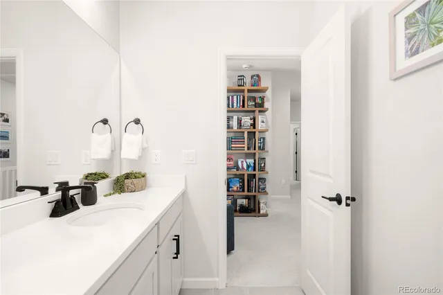a kitchen with a refrigerator and a sink