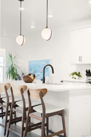 a kitchen with a table and chairs in it