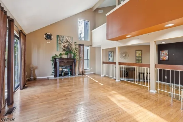 a view of a livingroom with furniture and a fireplace