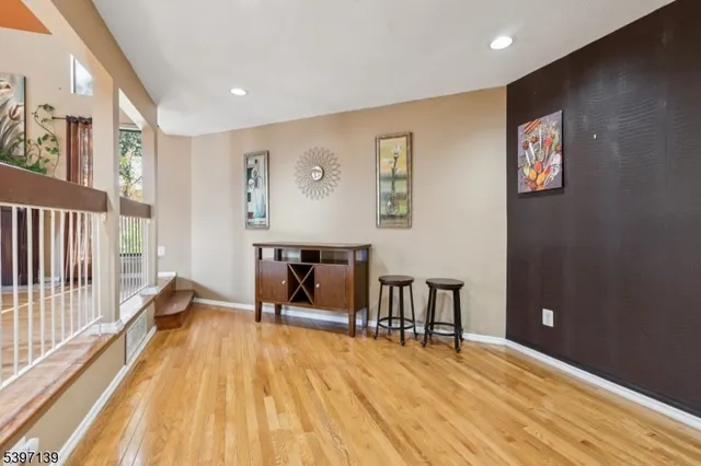 a view of a livingroom with furniture and wooden floor