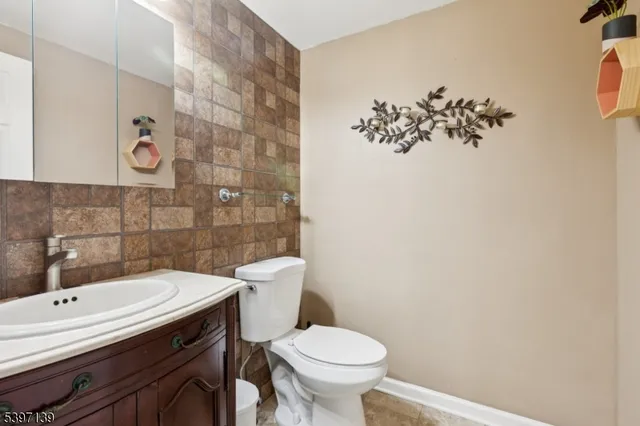 a bathroom with a sink a toilet and a shower