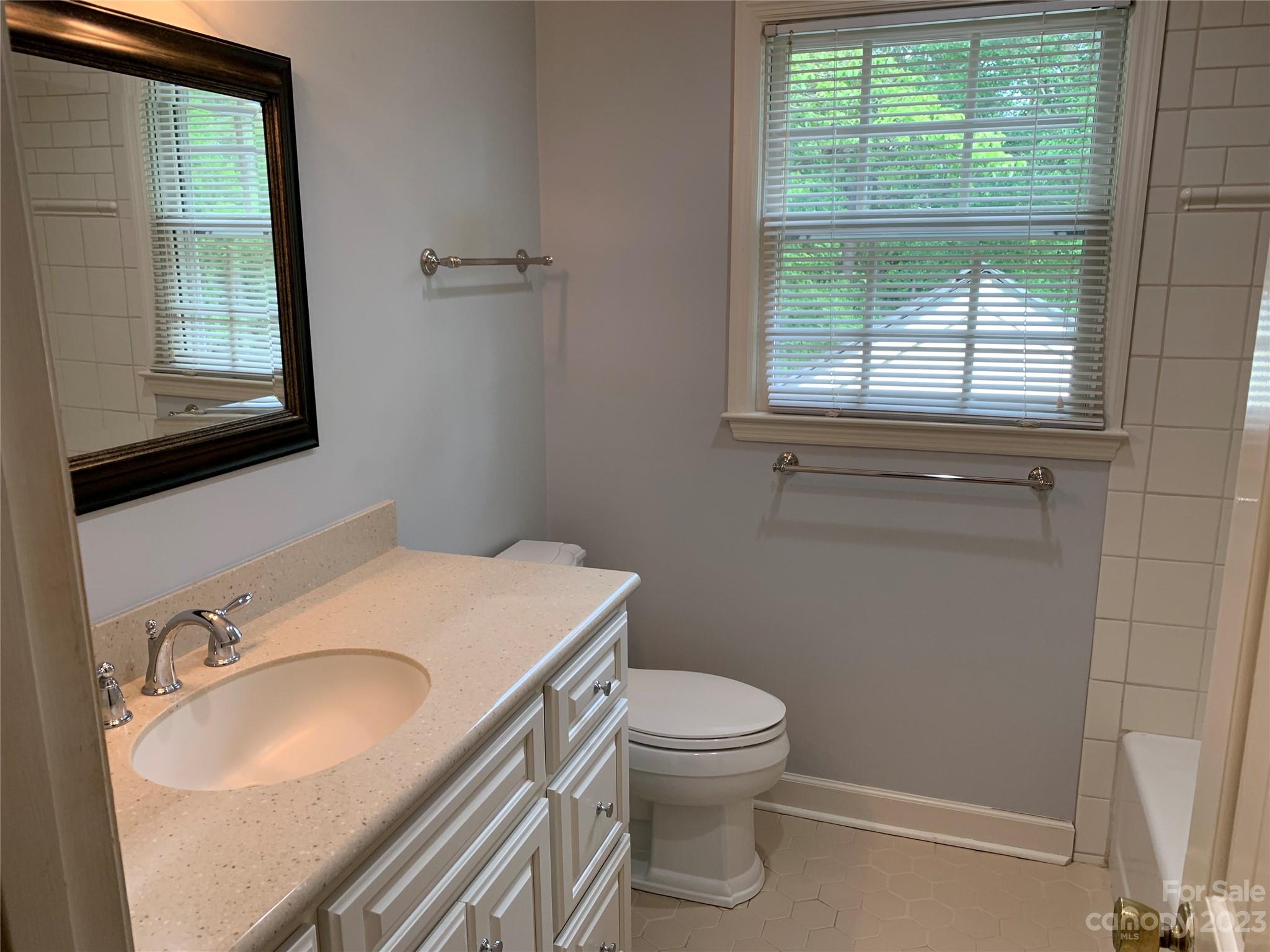 909 Nightingale Road Rock Hill, SC 29732 - Photo 24 of 38 a bathroom with a sink toilet and window