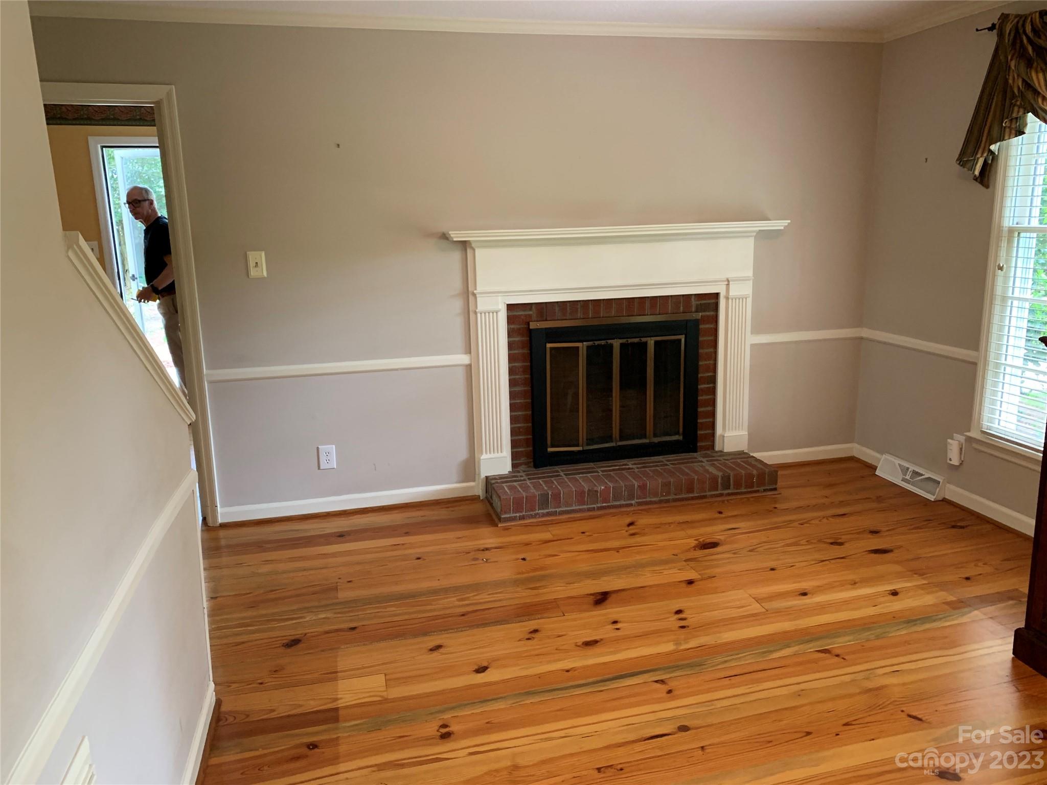 909 Nightingale Road Rock Hill, SC 29732 - Photo 3 of 38 a view of a livingroom with wooden floor and a fireplace