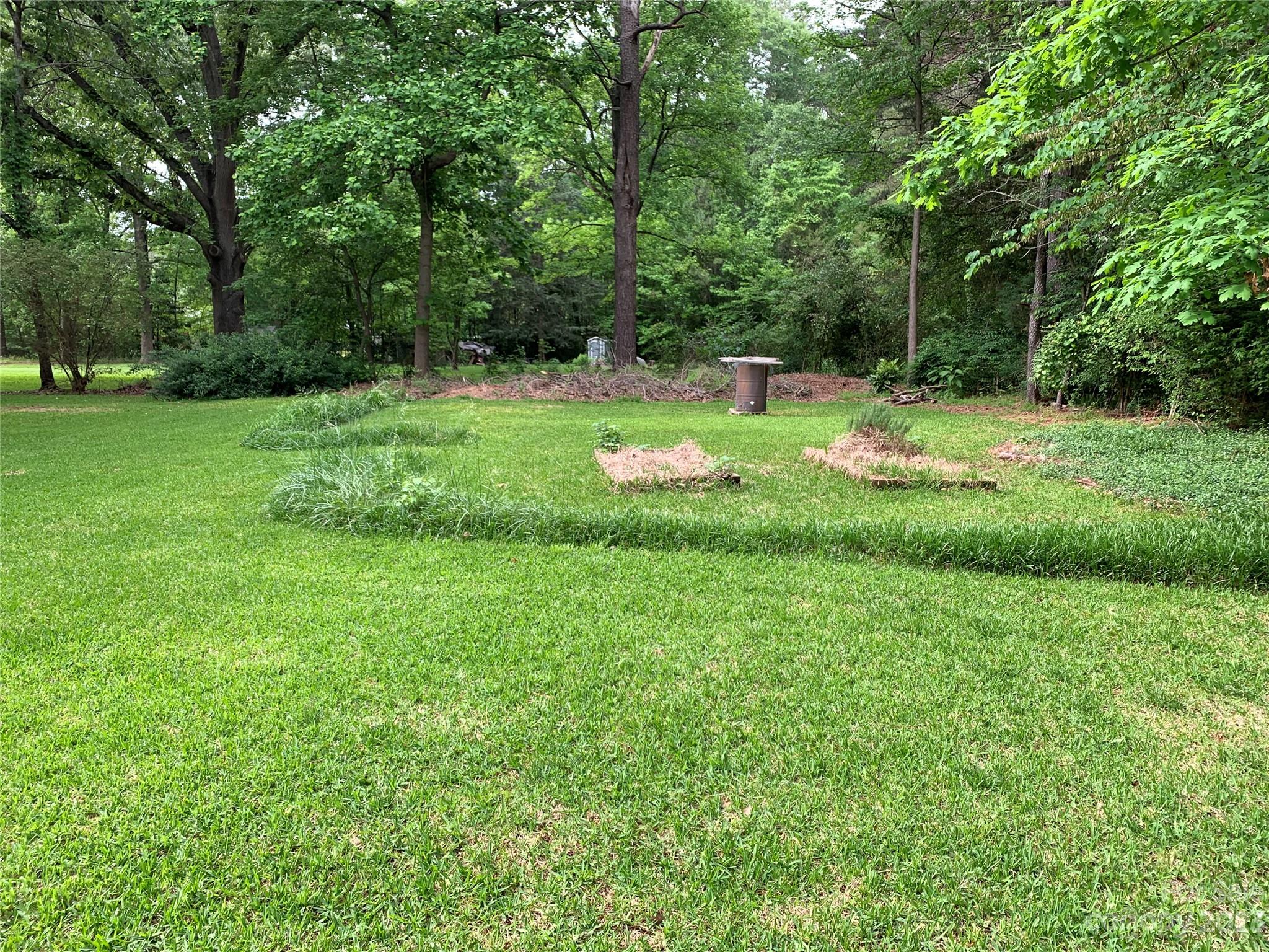 909 Nightingale Road Rock Hill, SC 29732 - Photo 34 of 38 a view of green field with trees in the background
