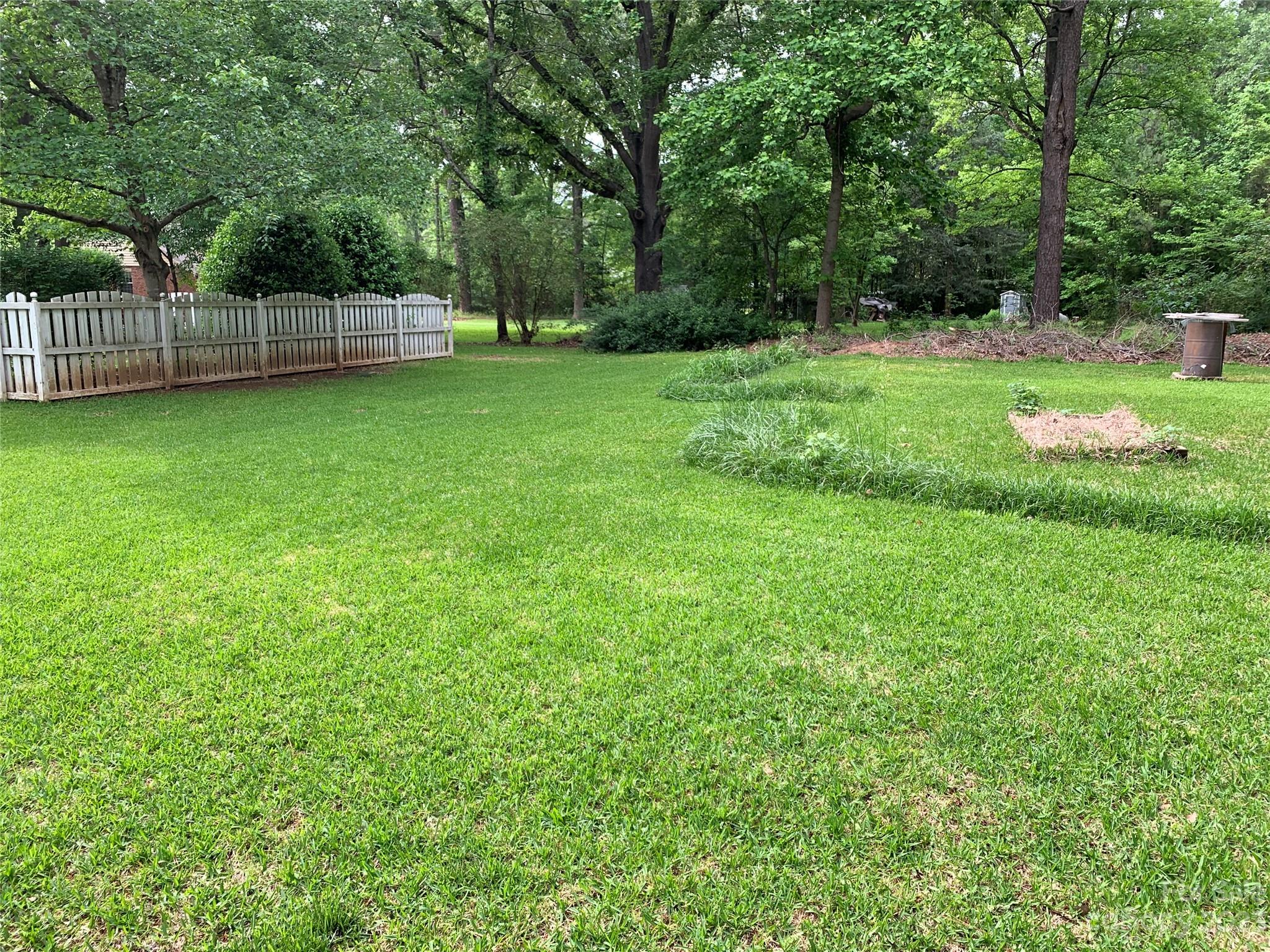909 Nightingale Road Rock Hill, SC 29732 - Photo 35 of 38 a view of a grassy field with trees in the background