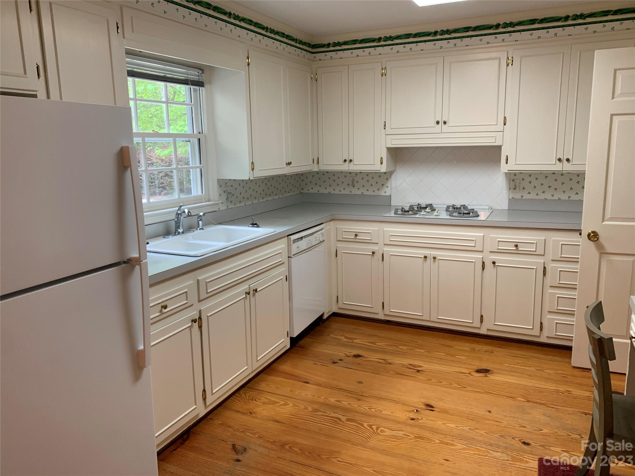 909 Nightingale Road Rock Hill, SC 29732 - Photo 9 of 38 a kitchen with a sink cabinets and window