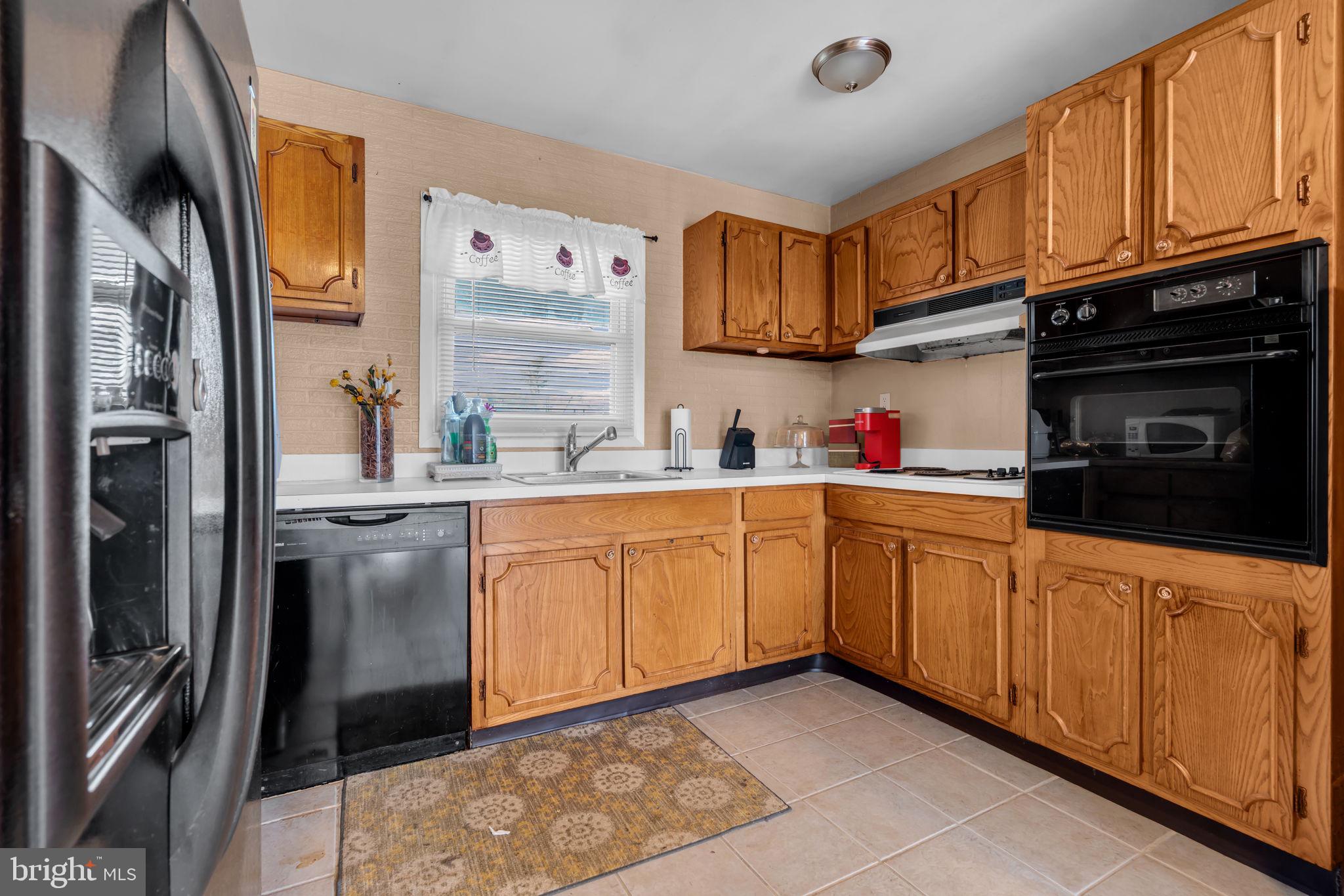 27 Genesee Lane Willingboro, NJ 08046 - Photo 11 of 25 a kitchen with stainless steel appliances granite countertop a refrigerator sink and stove