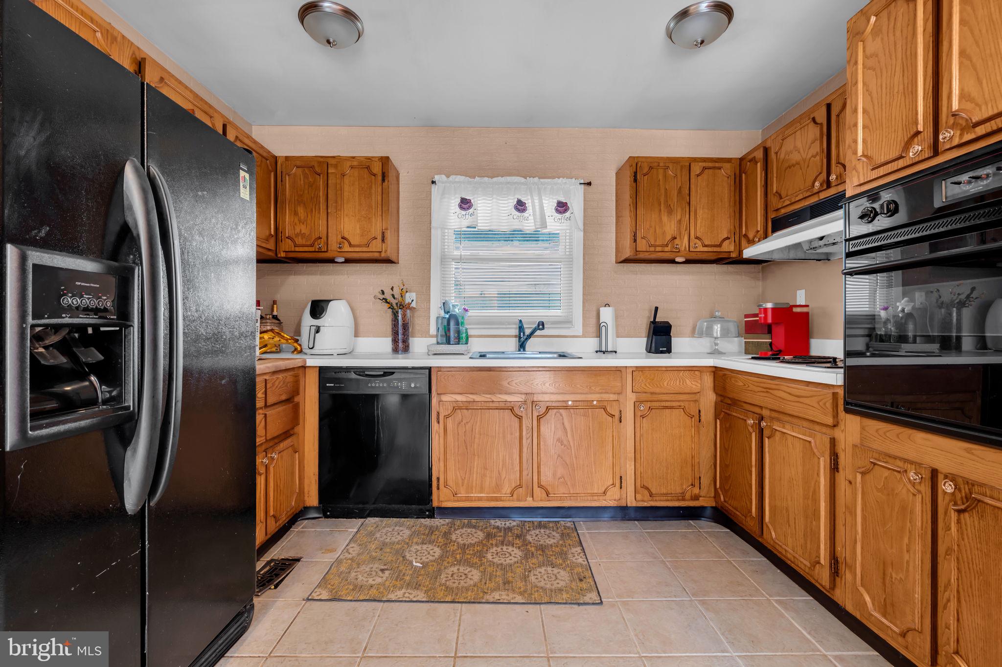 27 Genesee Lane Willingboro, NJ 08046 - Photo 12 of 25 a kitchen with stainless steel appliances granite countertop a refrigerator oven a sink and dishwasher