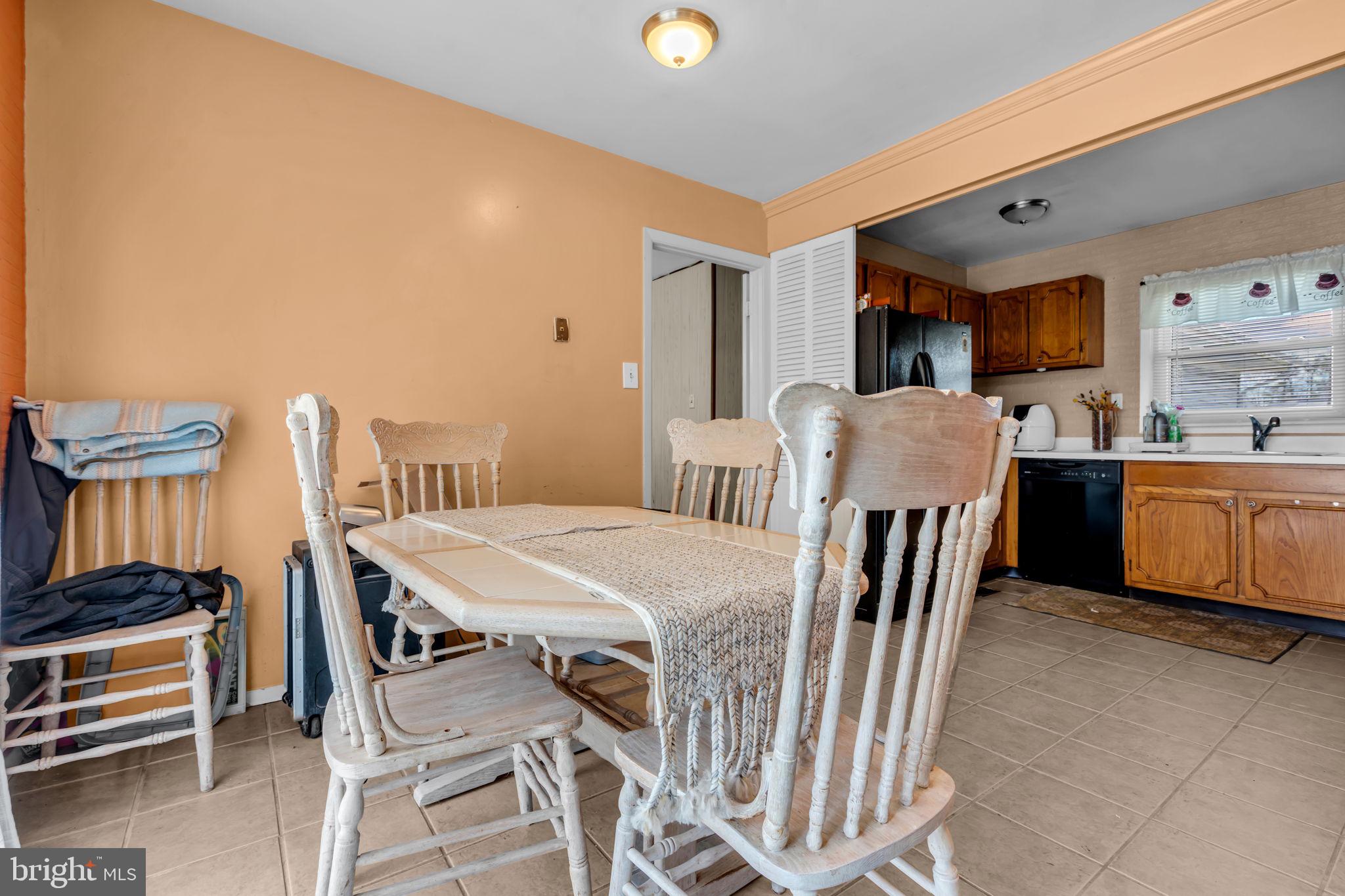 27 Genesee Lane Willingboro, NJ 08046 - Photo 13 of 25 a dining room with a table chairs and a kitchen