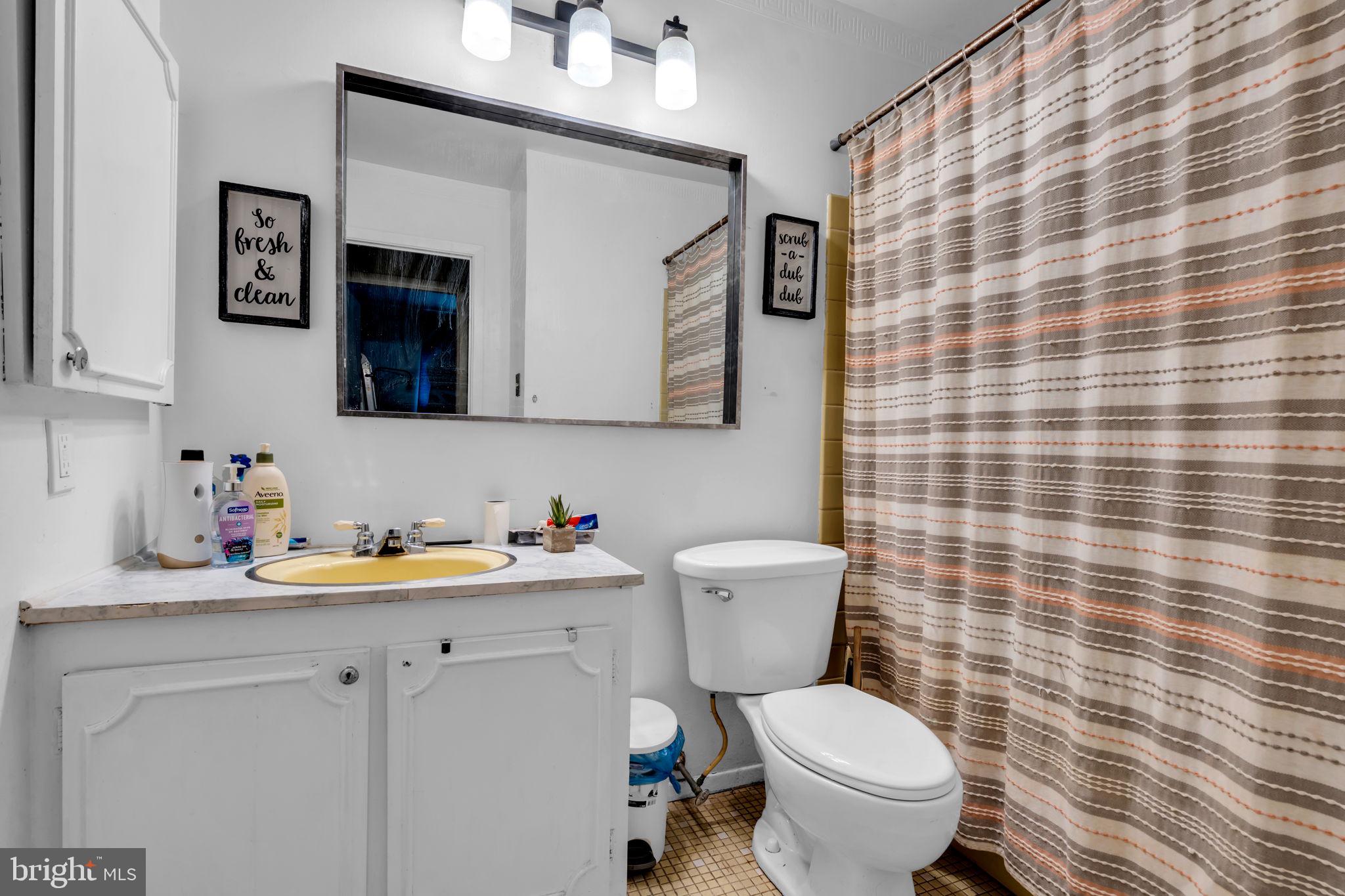 27 Genesee Lane Willingboro, NJ 08046 - Photo 16 of 25 a bathroom with a toilet sink and mirror