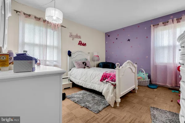 a bed room with a bed and a window