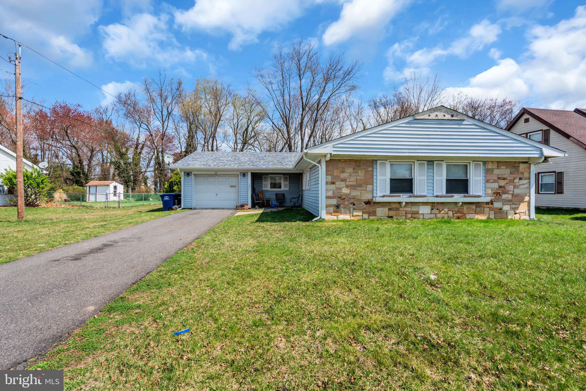 27 Genesee Lane Willingboro, NJ 08046 - Photo 23 of 25 a front view of a house with garden