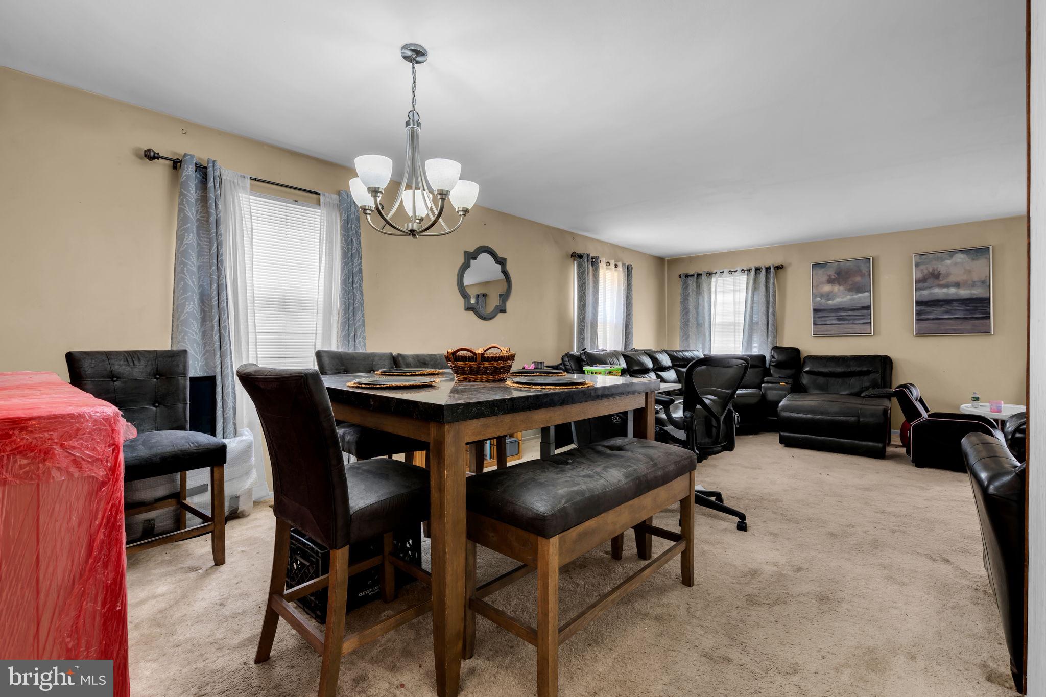 27 Genesee Lane Willingboro, NJ 08046 - Photo 6 of 25 a view of a dining room with furniture and a chandelier