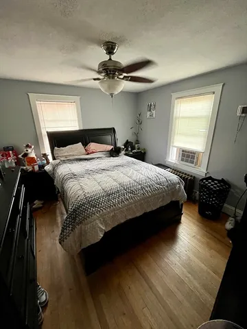 a bedroom with a bed and a mirror