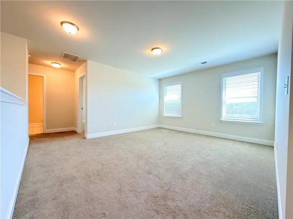 a bathroom with a granite countertop sink mirror and bathtub