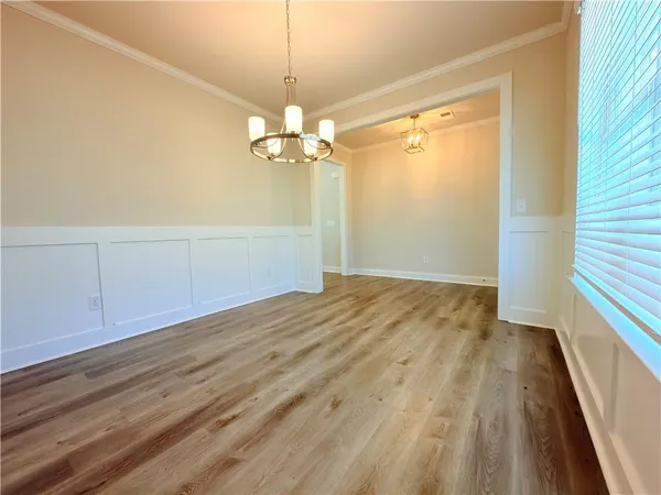 a kitchen with stainless steel appliances kitchen island granite countertop a refrigerator a stove and a sink