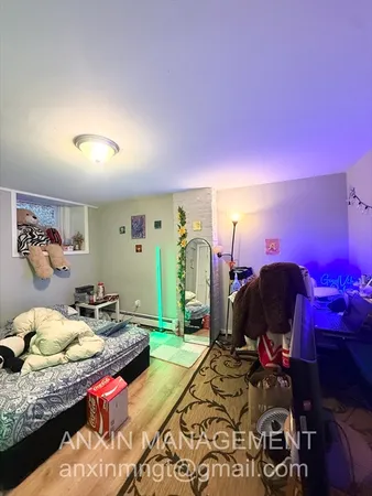 a bedroom with a bed and a closet