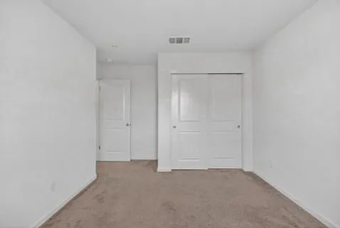 a bathroom with a toilet and a bathtub