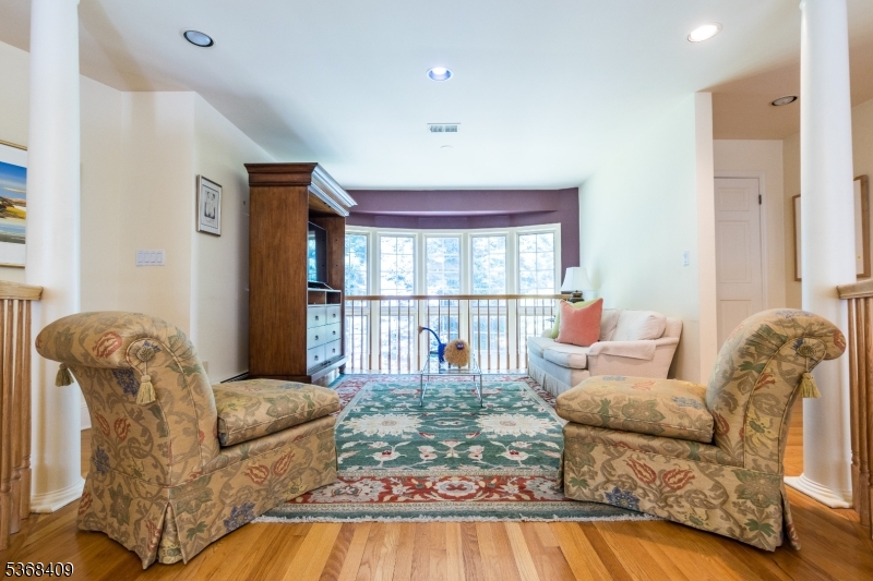 12 Kips Ridge, Unit 12 Montclair, NJ 07042 - Photo 19 of 37 a living room with furniture and a floor to ceiling window