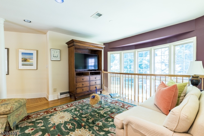 12 Kips Ridge, Unit 12 Montclair, NJ 07042 - Photo 20 of 37 a living room with furniture and a flat screen tv