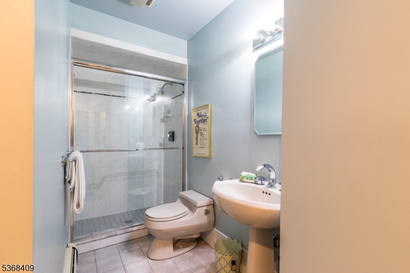 12 Kips Ridge, Unit 12 Montclair, NJ 07042 - Photo 25 of 37 a white toilet sitting next to a bathroom sink