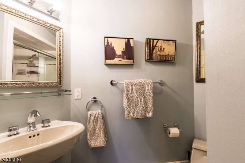 12 Kips Ridge, Unit 12 Montclair, NJ 07042 - Photo 26 of 37 a bathroom with a sink and mirror