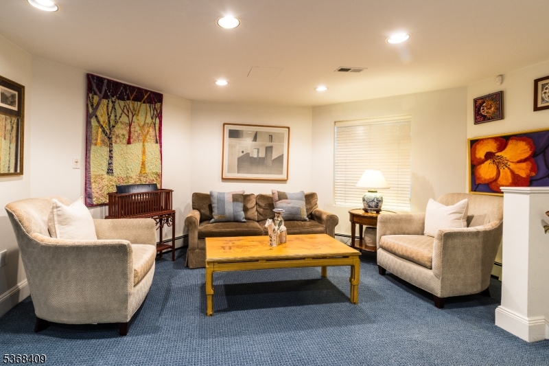 12 Kips Ridge, Unit 12 Montclair, NJ 07042 - Photo 29 of 37 a living room with furniture and a flat screen tv