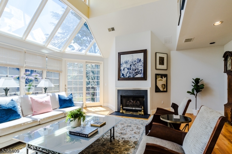 12 Kips Ridge, Unit 12 Montclair, NJ 07042 - Photo 5 of 37 a living room with furniture large window and a fireplace