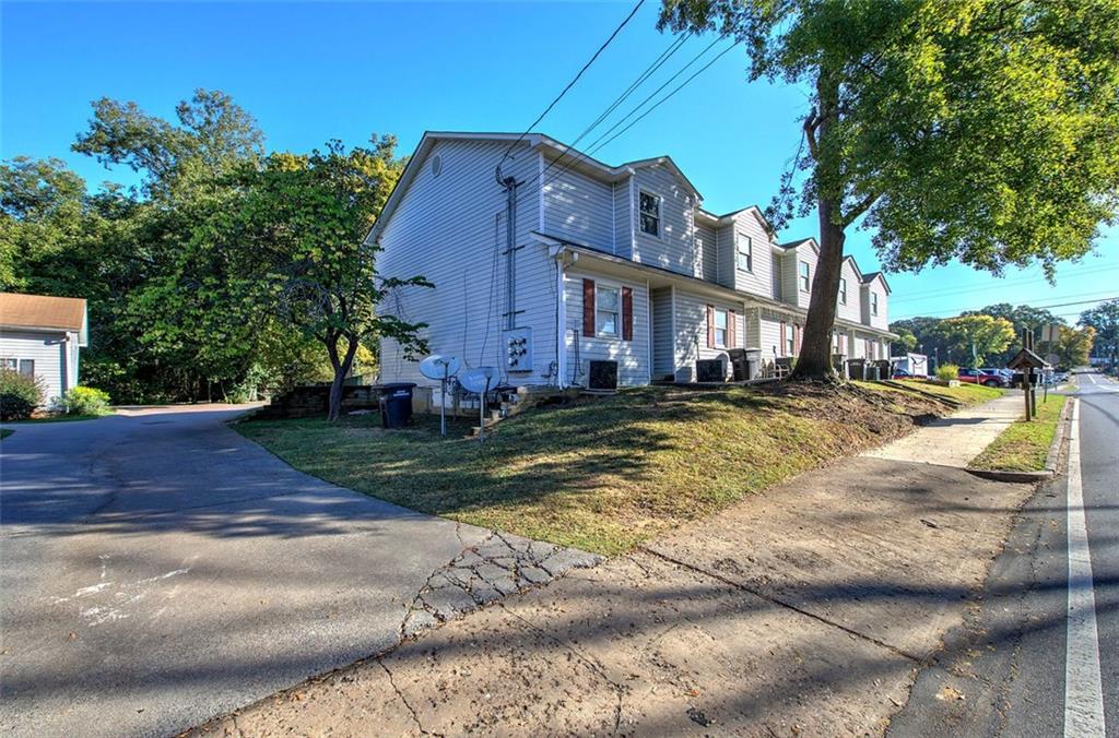 204 Johnson Street Cartersville, GA 30120 - Photo 14 of 27 a view of a house with a yard