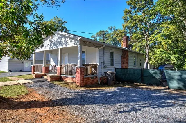 an aerial view of a house with yard