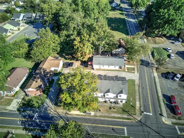 an aerial view of a residential houses with outdoor space
