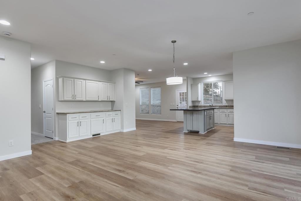 365 Alpine Heights Road Alpine, CA 91901 - Photo 10 of 52 a large kitchen with kitchen island a stove a refrigerator a sink dishwasher and a oven with cabinets