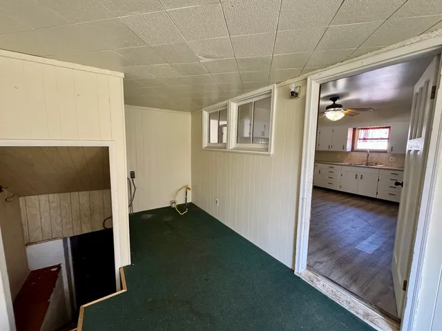 a view of livingroom with hardwood floor and a ceiling fan