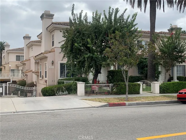 a dining room with furniture a fireplace and wooden floor