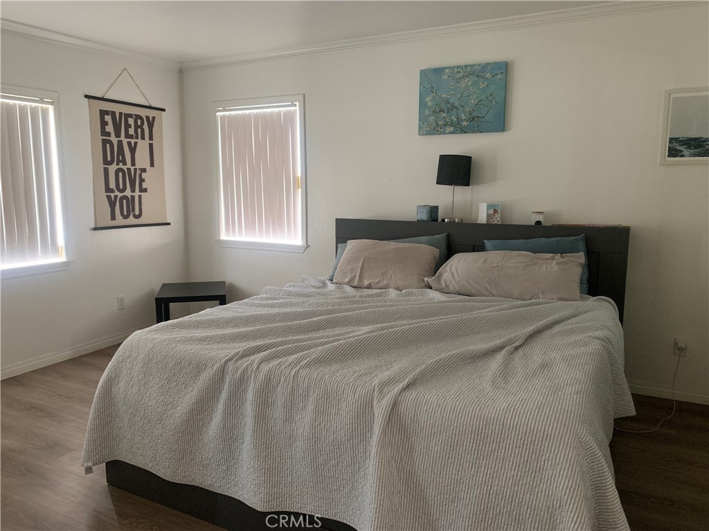 110 North Marengo Avenue, Unit D Alhambra, CA 91801 - Photo 13 of 14 a bedroom with a bed and a window