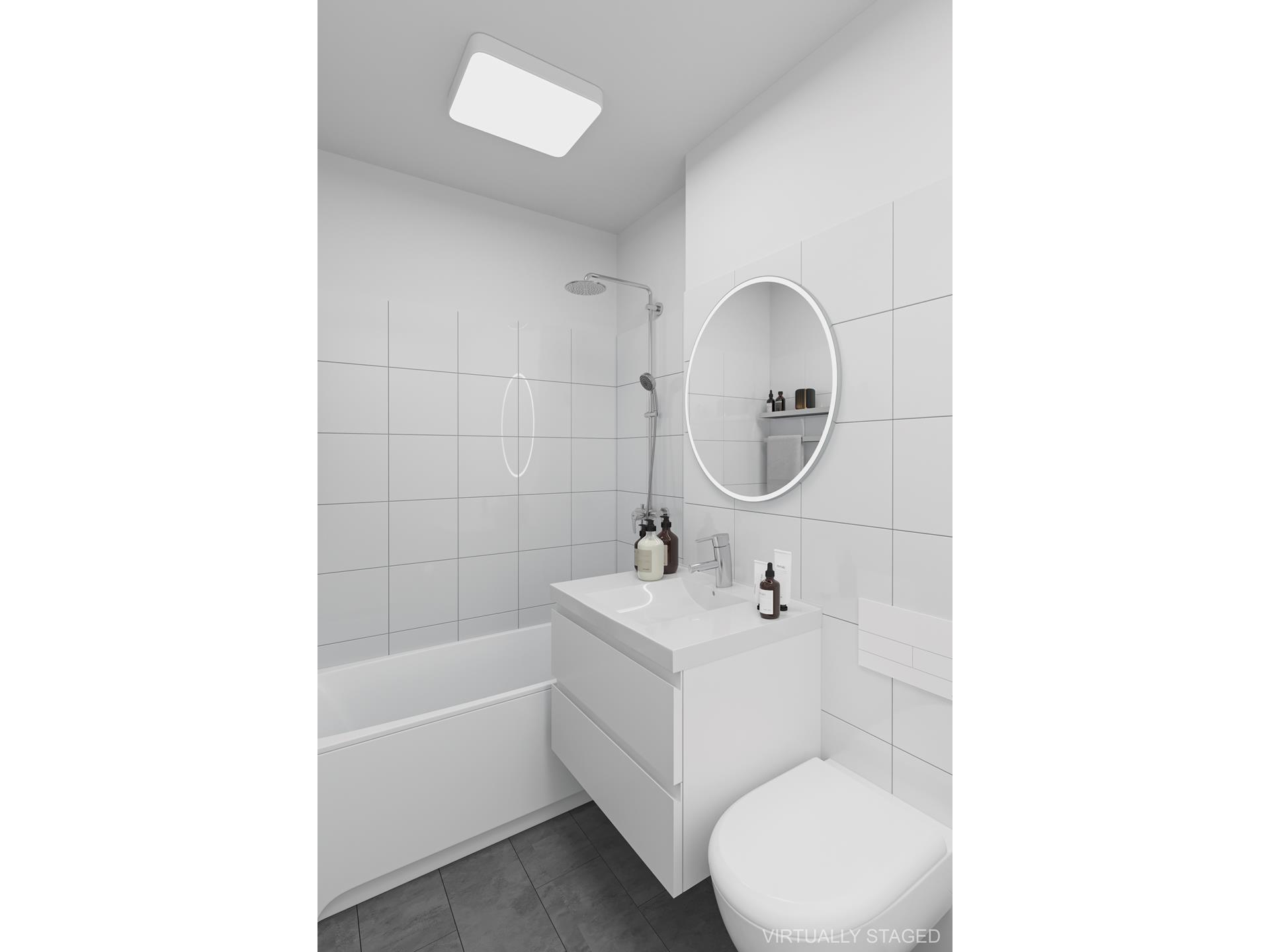 40 East 84th Street, Unit 4A Manhattan, NY 10028 - Photo 17 of 22 a bathroom with a sink toilet and tub