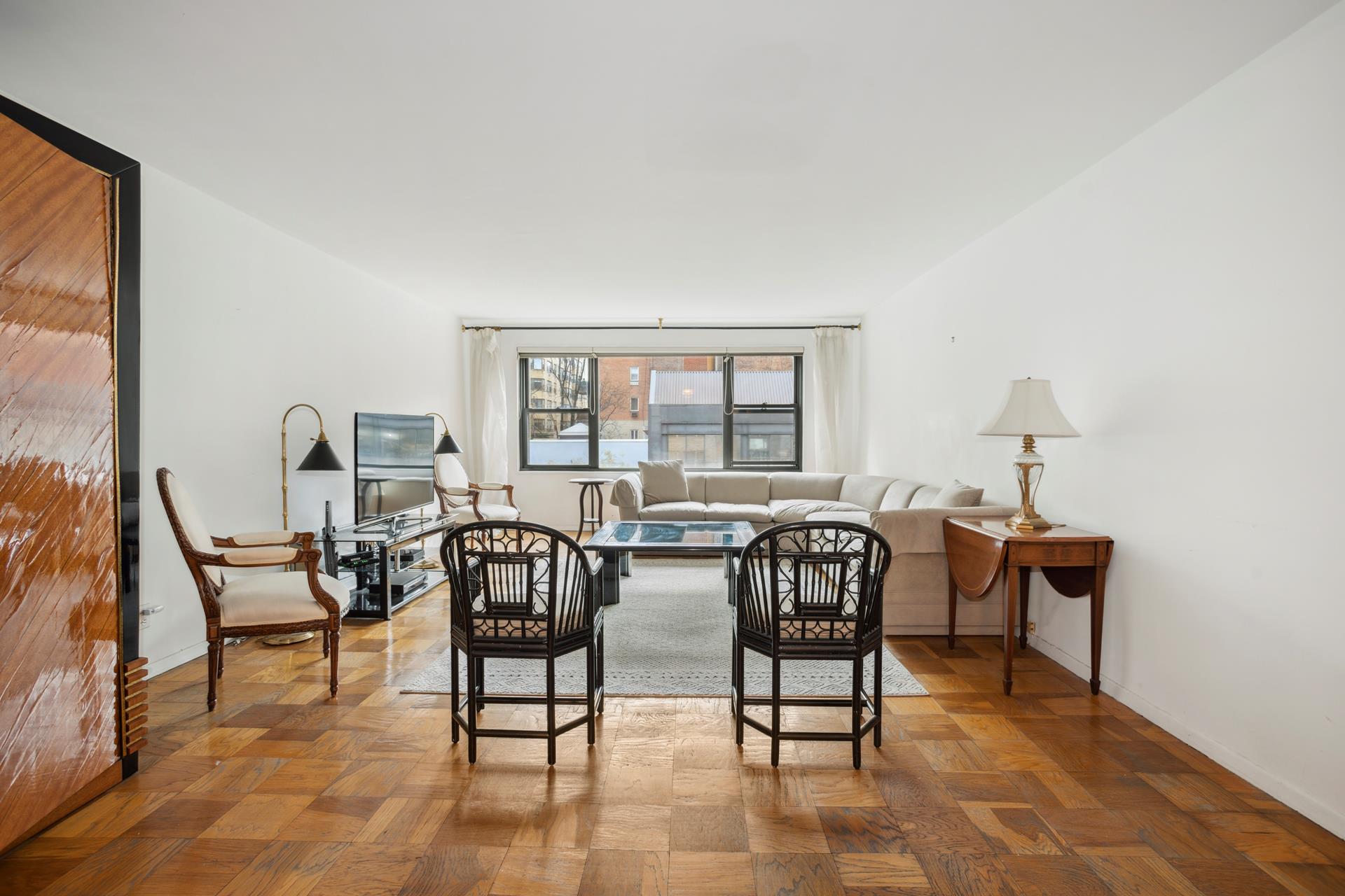 40 East 84th Street, Unit 4A Manhattan, NY 10028 - Photo 4 of 22 a view of a workspace with furniture and window