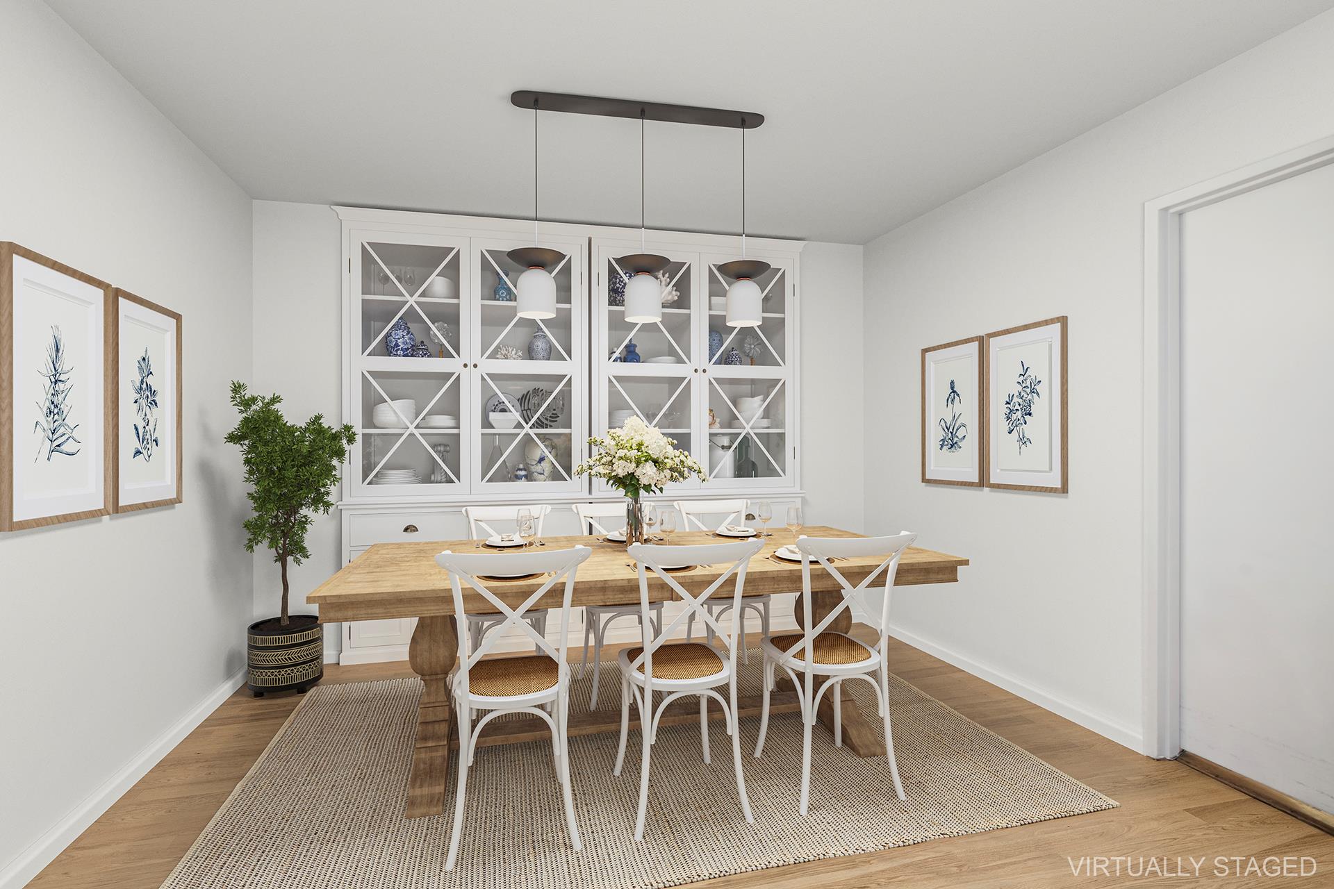 40 East 84th Street, Unit 4A Manhattan, NY 10028 - Photo 8 of 22 a dining room with furniture a rug and wooden floor