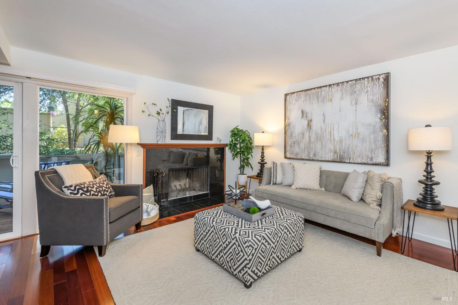 36 Schmidt Lane San Rafael, CA 94903 - Photo 2 of 31 a living room with furniture a large window and a fireplace